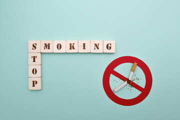 Stop smoking message with broken cigarette inside prohibition symbol