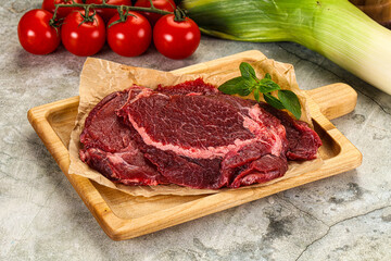 Raw beef cheeks cut for cooking