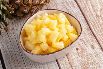 Sweet canned pineapple fruit pieces