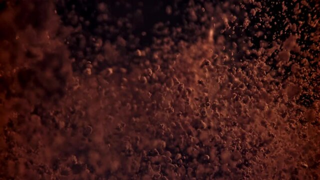 The cocoa powder flies up and down. Filmed on a high-speed camera at 1000 fps. High quality FullHD footage