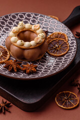 Round chocolate tart or pie with cream berry filling