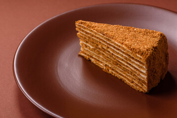 A slice of honey puff cake or pumpkin, carrot and cream pie, vegan sweets