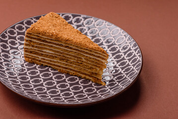 A slice of honey puff cake or pumpkin, carrot and cream pie, vegan sweets