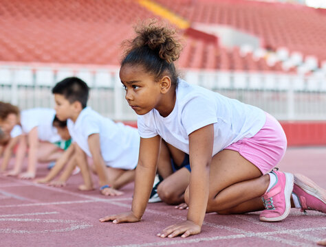 child sport athlete competition running exercise sprinting line start race runner preparation success concentration starting sprinter competitive finish winner