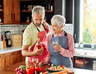 love kitchen senior woman couple home portrait wine glass celebration retirement toast wineglass alcohol holiday beverage red romantic anniversary dating toasting valentine eve