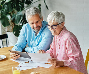 woman man senior bill finance retirement couple home wife budget husband mature business meeting...