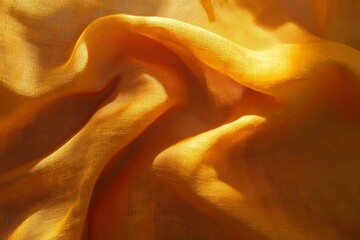 A close-up view of  soft, flowing, golden fabric.