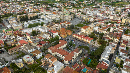 Aerial view of the historic center of the city of Pompeii, in Campania, Italy. In the center of the town is the Pontifical Shrine of the Blessed Virgin of the Rosary. It is the cathedral of the town.