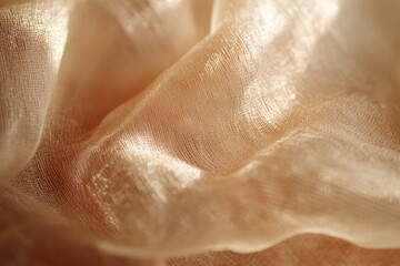 Fototapeta premium Closeup view of soft, flowing, light peachy fabric.