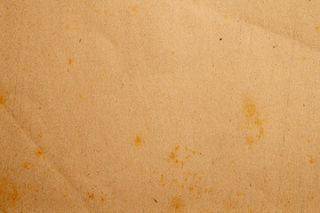 Grungy brown paper texture with stains and creases
