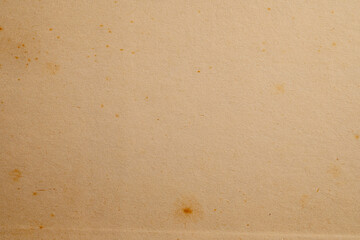 Aged beige paper texture with stains
