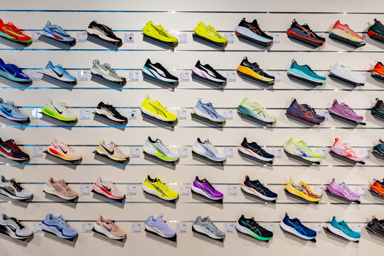 Various sneaker models displayed on store wall. Udine, Italy. April 29, 2025.