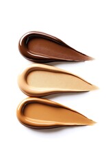Fototapeta premium Different shades of foundation, from light to dark on a white background