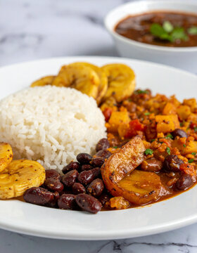 Traditional Costa Rican casado with rice, beans, plantains, local flavor.