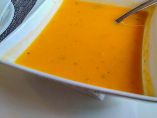 Creamy vegetable soup in modern bowl