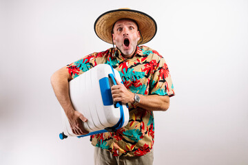 Surprised man with travel suitcase
