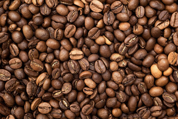 Textured background of freshly roasted coffee beans