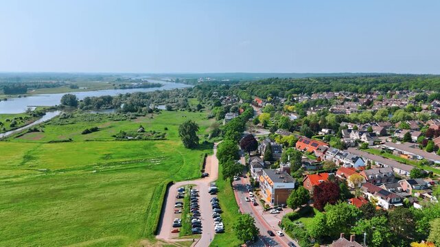 Beautiful picturesque city with low-rise architecture on the green waterfront of the river. Panorama of Rhenen, Province Utrecht, the Netherlands.