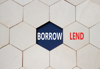 Lend or Borrow symbol. Concept word Lend or Borrow on wooden comb puzzle. Beautiful deep blue...