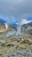 Several fumaroles in the volcanic crater area. Fumarol containing sulfur, solfatara. Papandayan mount,Indonesia. Vertical photography