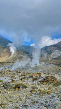 Several fumaroles in the volcanic crater area. Fumarol containing sulfur, solfatara. Papandayan mount,Indonesia. Vertical photography