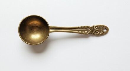 Brass teaspoon isolated on white