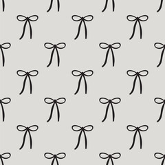 black coquette bows ribbons seamless pattern on a grey background. for prints, wrapping paper, wallpaper, textile, stationary, fabric
