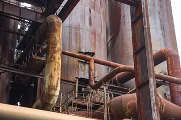 Fotobehang Gebouw in Puin Rusty steel factory abandoned buildings  © Gudellaphoto