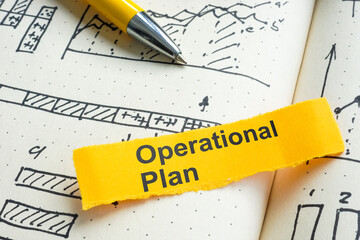 Operational plan notebook with charts. Business strategy concept.