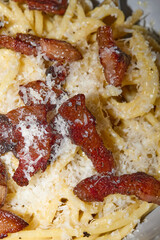 Spaghetti Carbonara with Crispy Bacon and Grated Cheese

