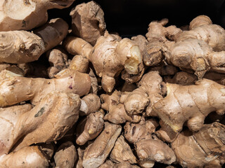 Fresh Organic Ginger Root Piled for Sale at Market