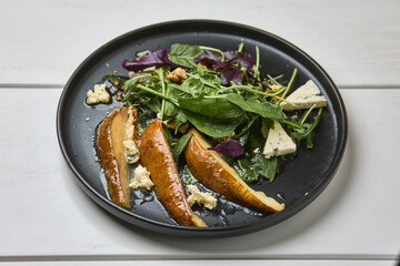 Gourmet pear salad with blue cheese and greens