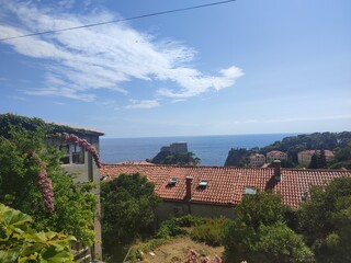 Scenic Coastal View with Red Tiled Rooftops and the Adriatic Sea in Dubrovnik, Croatia