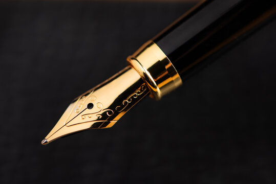 Fountain pen, the tip of a beautiful fountain pen in detail, selective focus.