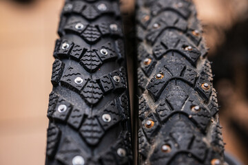 Studded bicycle tires macro shot.