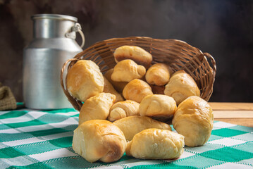 Homemade bread, a beautiful breakfast table with delicious homemade bread on a rustic wooden surface with a tablecloth, selective focus.