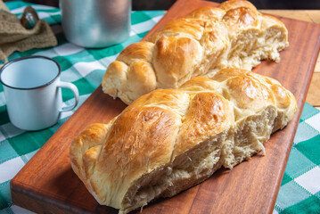 Homemade bread, a beautiful breakfast table with delicious homemade bread on a rustic wooden surface with a tablecloth, selective focus.