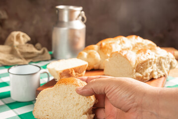 Homemade bread, a beautiful breakfast table with delicious homemade bread on a rustic wooden surface with a tablecloth, selective focus.