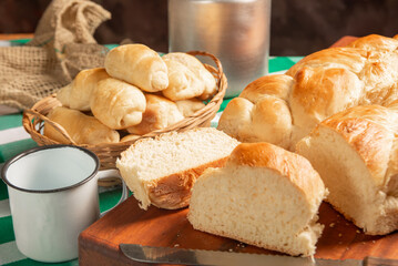 Homemade bread, a beautiful breakfast table with delicious homemade bread on a rustic wooden surface with a tablecloth, selective focus.