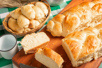 Homemade bread, a beautiful breakfast table with delicious homemade bread on a rustic wooden surface with a tablecloth, selective focus.