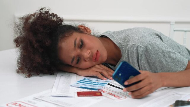 Stressed young woman has financial problems with credit card debt to pay crucial show concept of bad personal money and mortgage pay management crisis.