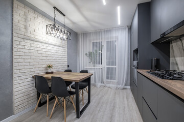 Interior of the modern luxure kitchen  in studio apartments in minimalistic style