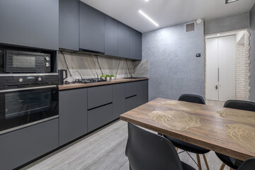 Interior of the modern luxure kitchen  in studio apartments in minimalistic style