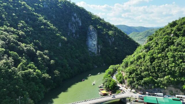 Drone footage of statue of a head on Danube river, Romania