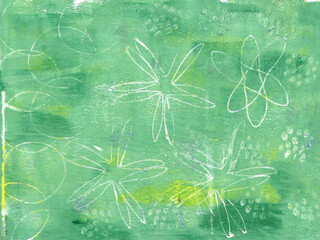 Texture in green and yellow with circle, star and dot patterns, printed using the Gelli print process.