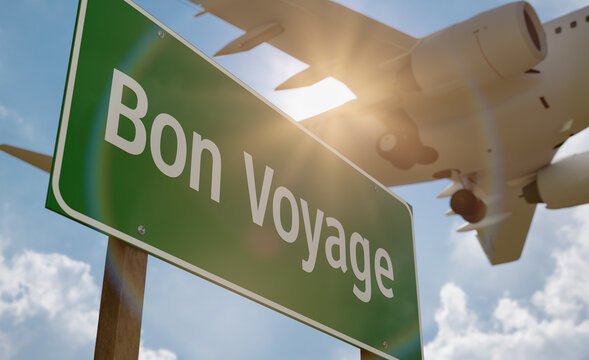 Bon Voyage Green Road Sign with Low Flying Airplane Just Above with Landing Gear Down. - Powered by Adobe