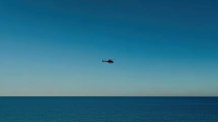 Fototapeta premium Helicopter flight over blue ocean