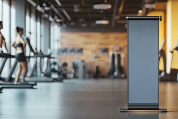  Blank pull-up banner mockup in modern gym setting with exercise equipment and athletes in background