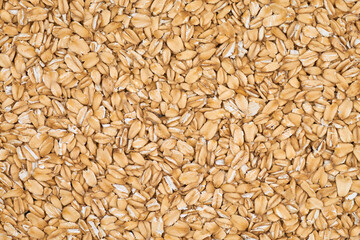Oat flakes, rolled oat, background or texture.