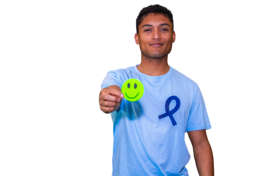 Young man showing smiley face supporting cancer awareness.